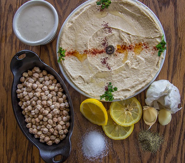 Ingredients for Hummus on a wood table