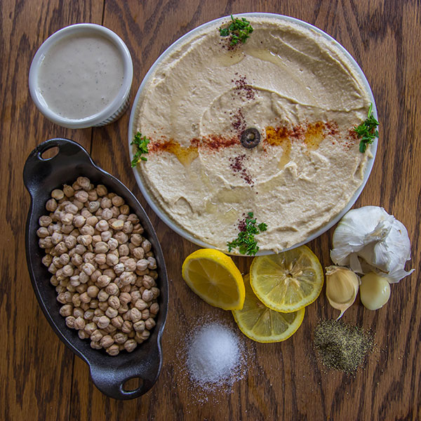 Ingredients for Hummus on a wood table